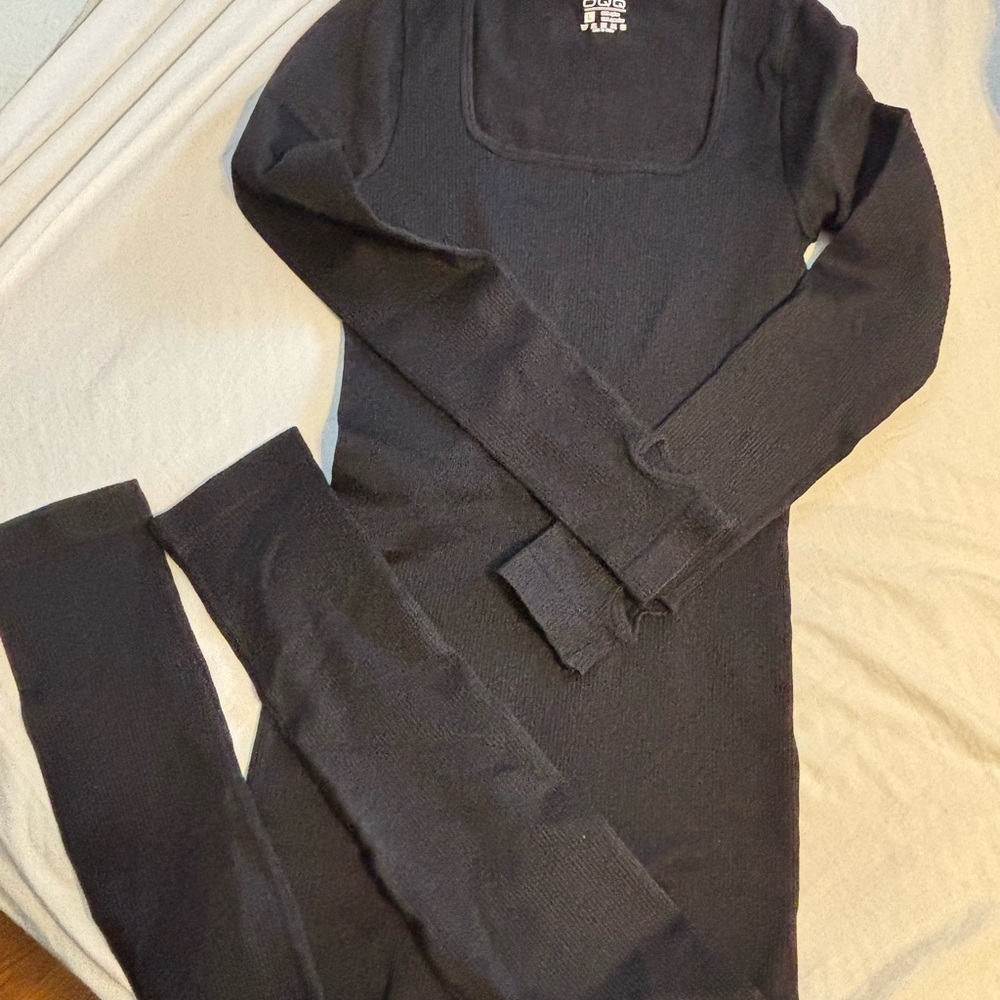 NWOT- OQQ -Black Long Sleeve one piece jumpsuit- L fitted
